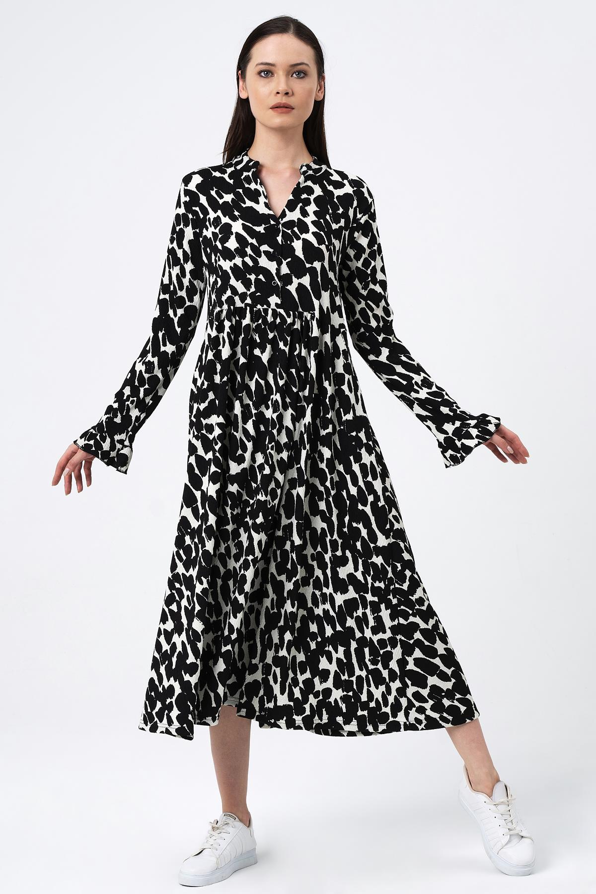 KOLU FIRFIRLI DESENLİ UZUN ELBİSE